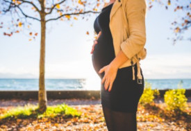 Pregnant Woman Wearing Beige Long Sleeve Shirt