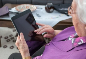 Senior woman using ipad